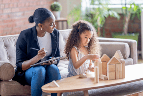 Coming Soon Instagram Post (2) Counselor with a young girl playing with blocks