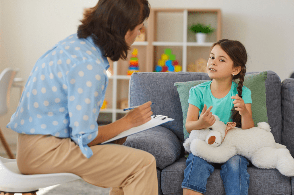Picture1 Counselor taking notes while talking with a young girl