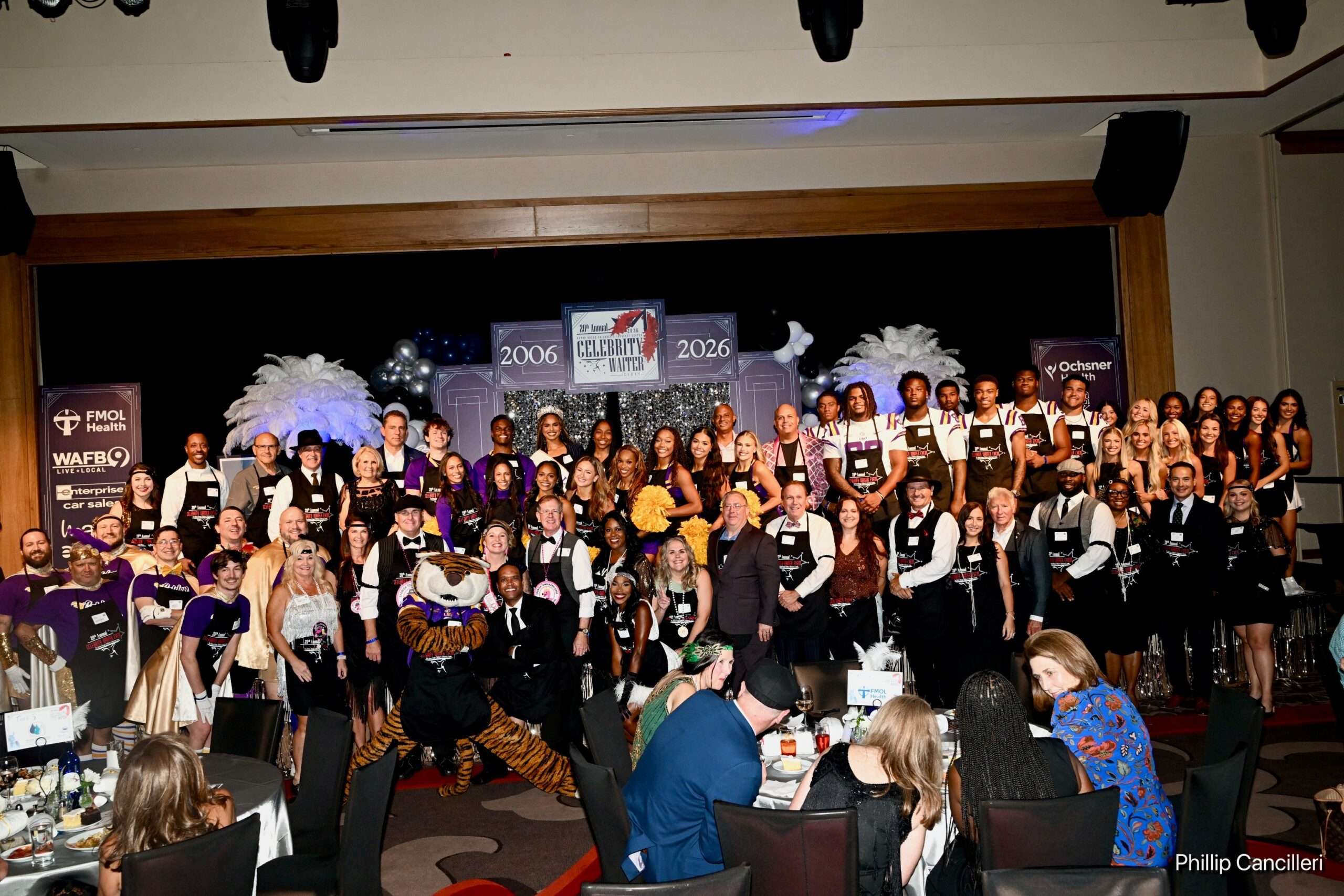 cw-group Celebrity Waiter event participants on stage